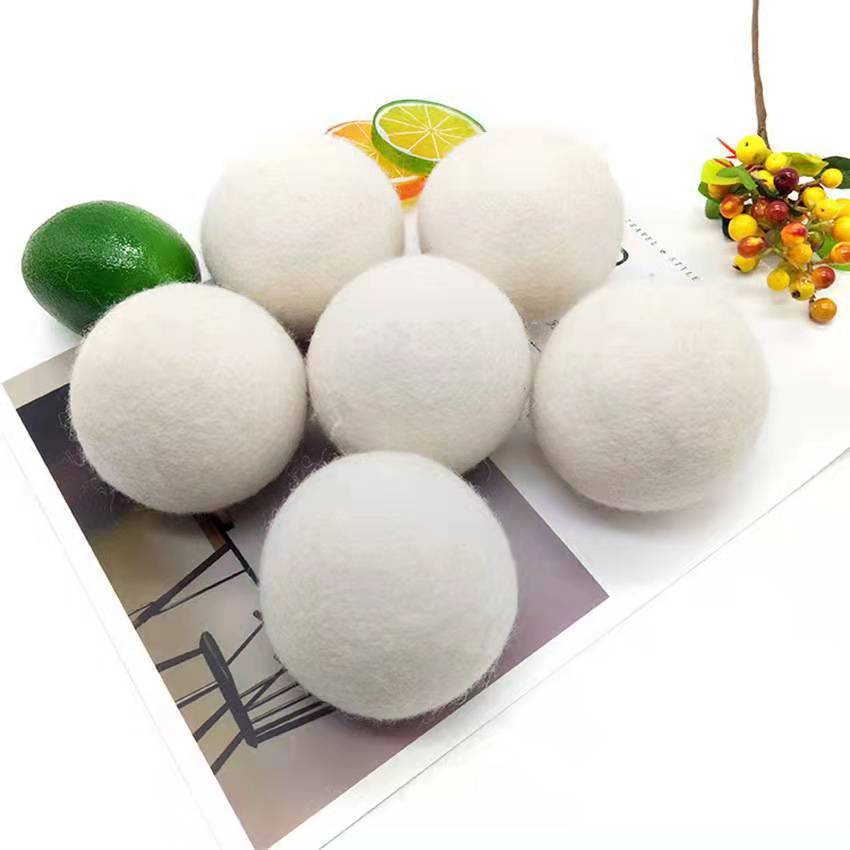 Six wool dryer balls arranged on a card