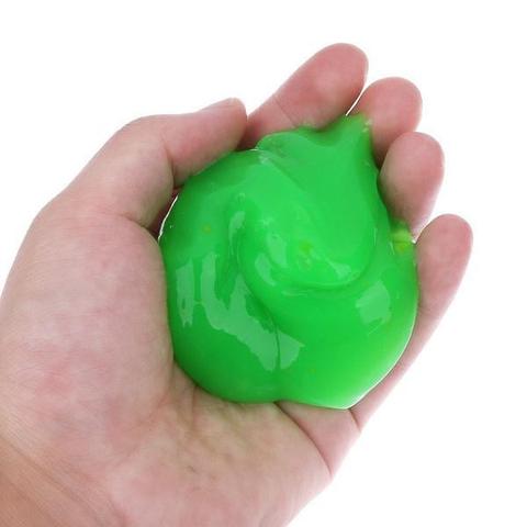 Magic Cleaning Gel picked up in hand showing stretchy texture