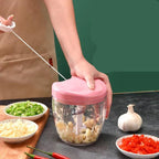 Pull-Cord Manual Chopper mincing garlic, chilli and spring onion with the ripcord pulled