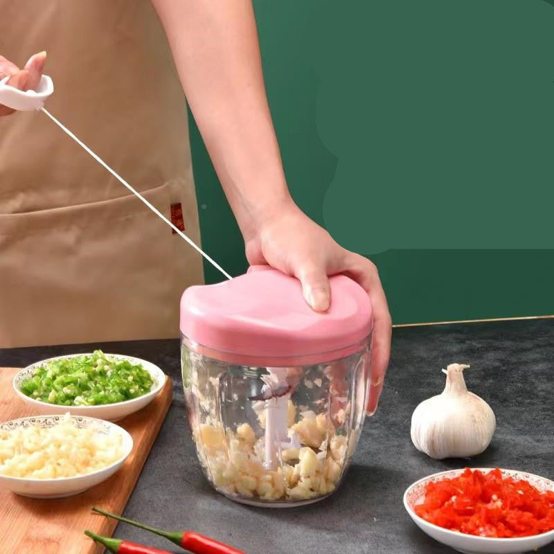 Pull-Cord Manual Chopper mincing garlic, chilli and spring onion with the ripcord pulled