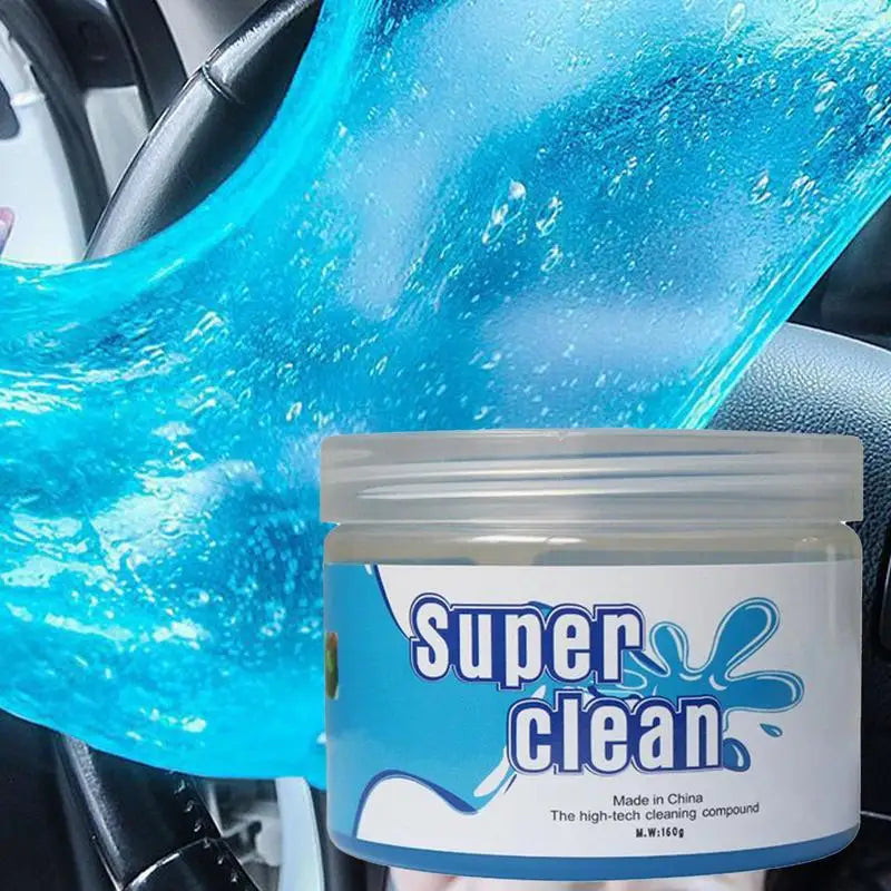 Blue cleaning gel being pulled from its Super Clean jar in a car interior