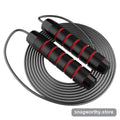 Coiled steel-cable jump rope with red and black weighted foam handles | Snagworthy.store