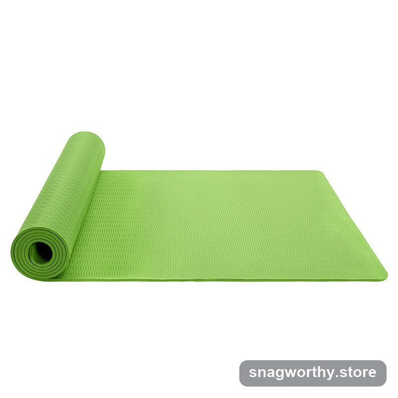 Green TPE yoga mat half unrolled showing textured non-slip surface | Snagworthy.store