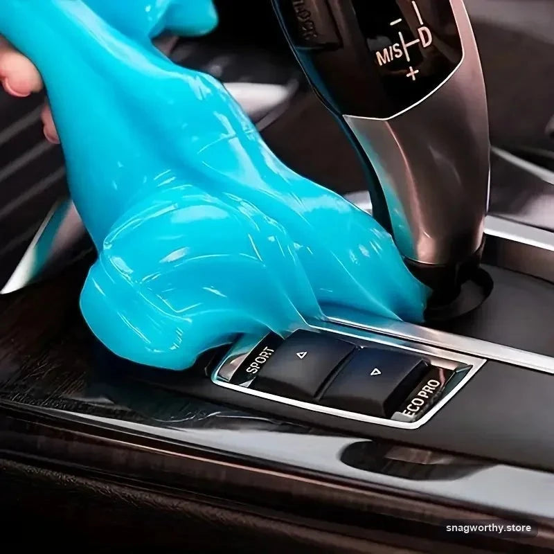 Magic Cleaning Gel being pressed into a car centre console to lift dust | Snagworthy.store