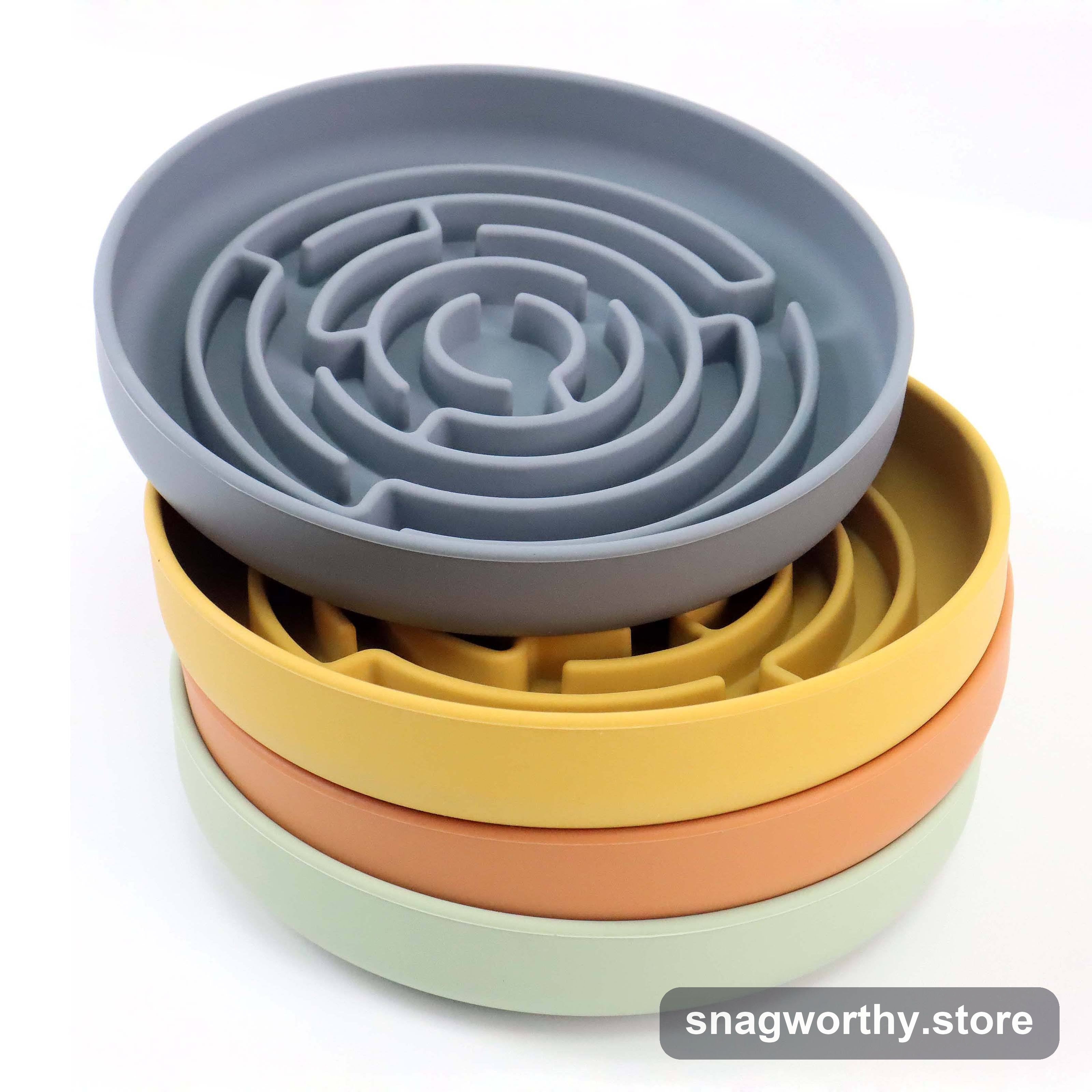 Four stacked silicone slow-feeder maze bowls in grey, yellow, orange and green | Snagworthy.store