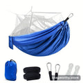 Camping hammock strung between trees | Snagworthy.store