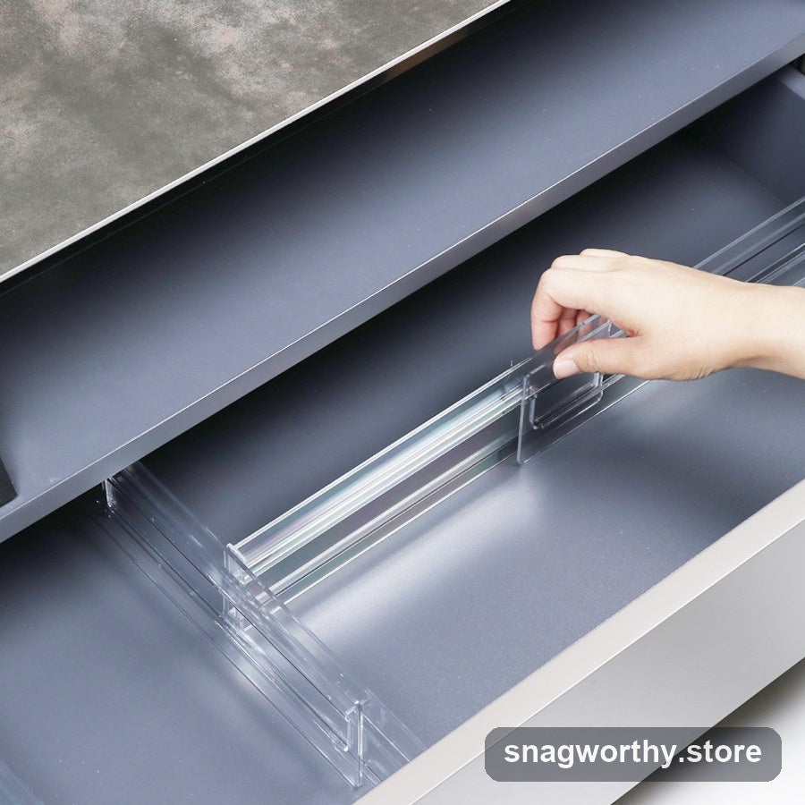 Adjustable clear drawer divider installed in a kitchen drawer | Snagworthy.store