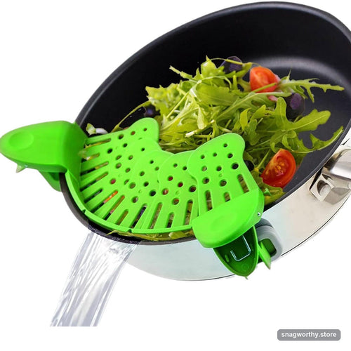 Pot strainer clipped onto pan rim | Snagworthy.store