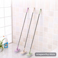Long-handle grout tile scrub brush three colors leaning on wall | Snagworthy.store