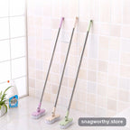Long-handle grout tile scrub brush three colors leaning on wall | Snagworthy.store