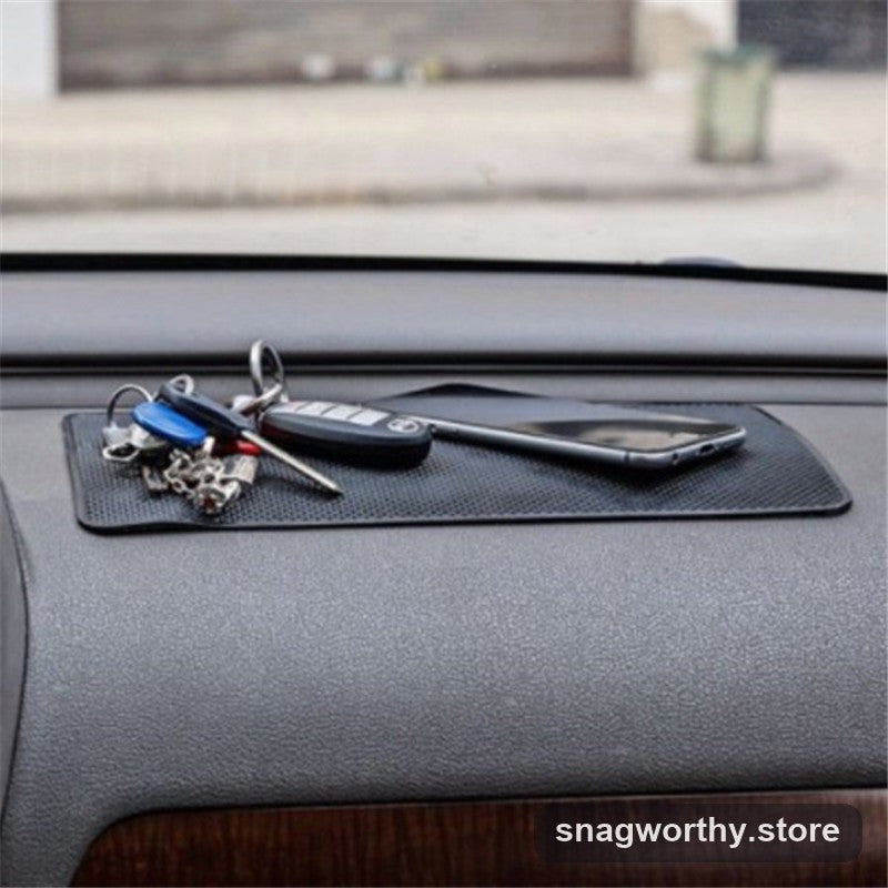 Dashboard mat gripping sunglasses in a car | Snagworthy.store
