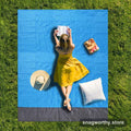 Blue and grey waterproof picnic blanket laid out on grass | Snagworthy.store