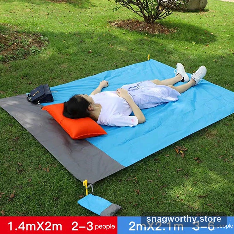 Picnic blanket in use outdoors showing size options | Snagworthy.store