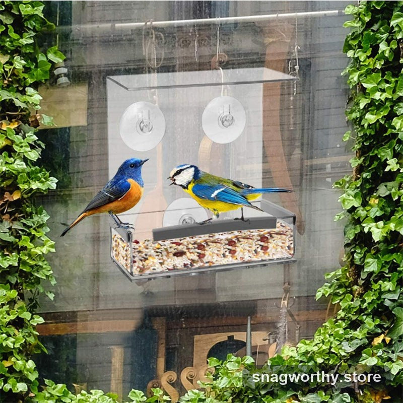 Clear acrylic window bird feeder with two birds feeding | Snagworthy.store