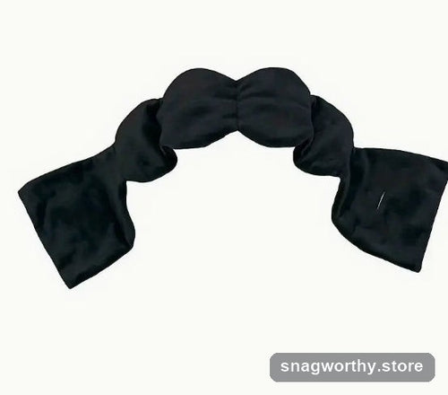 CalmWrap weighted eye pillow in black, flat lay | Snagworthy.store