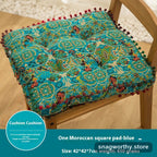 PlushSit tufted floor cushion in blue on a wooden chair, close-up | Snagworthy.store