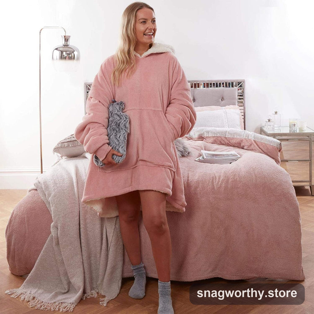 SnugDen oversized hooded blanket hoodie in pink, seated view | Snagworthy.store