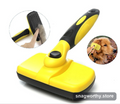 Self-cleaning slicker brush being used on a golden retriever | Snagworthy.store
