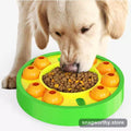 Dog eating from slow-feed puzzle treat wheel | Snagworthy.store