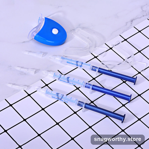LED teeth whitening kit with gel syringes and mouth tray