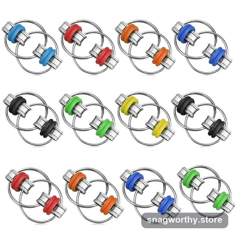 Twelve colour variants of the bike-chain gear ring fidget toy laid out in a grid | Snagworthy.store